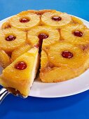 Pineapple upside-down cake, a piece on server