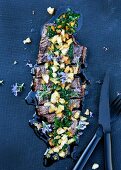 Grilled beef with a herb sauce