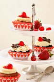 Cupcakes on a tiered cake stand: black forest and red velvet cupcakes