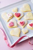 Heart-shaped butter biscuits decorated with sugar hearts