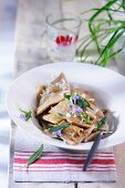 Ravioli with herbs and edible flowers
