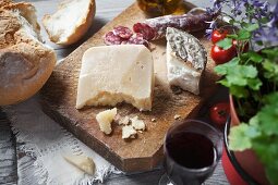 Sheep's cheese, bread, salami and red wine