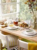 A table laid with peach salad and wine