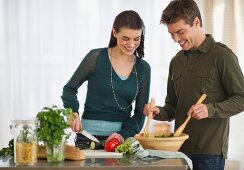 Couple cooking in kitchen