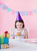 Portrait of girl (6-7) celebrating birthday