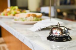 Bell on counter in restaurant