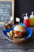 Cheeseburger with onion rings, chips and cola (USA)