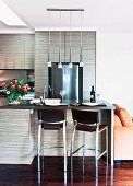 Open kitchen with breakfast bar and chrome bar stools