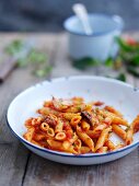 Penne all'arrabbiata (pasta with spicy bacon and tomato sauce, Italy)