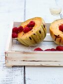 Grilled cantaloupe-melon with fresh raspberries and pepper