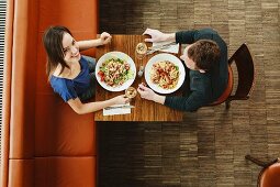 A couple eating lunch in the pub