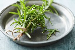 Rosemary sprigs on a tin plate
