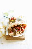 Lebanese flatbread filled with minced meat and tomato salsa