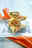Wraps filled with vegetables, smoked turkey breast and tuna