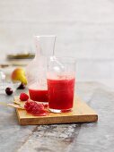 Pear and raspberry juice with cherries and cranberries