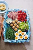 Ingredients for niçoise salad with a mayonnaise dressing