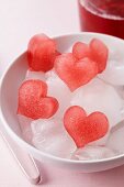 Red, heart-shaped ice cubes