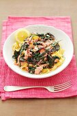 Ribbon pasta with spinach, beetroot leaves and salmon