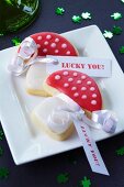 Toadstool-shaped biscuits with message tags as a gift