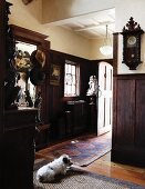 Entryway in a country home with dark wood paneling