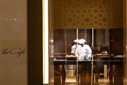 A chef at work in an open hotel kitchen