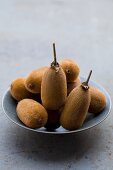 Several kiwis in a bowl