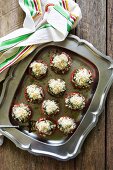 Oven-baked tomatoes stuffed with spinach, with a breadcrumb crust