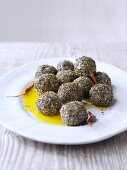 Balls of yoghurt cheese coated in herbs, with olive oil