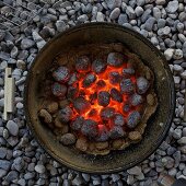 A barbeque with glowing coals
