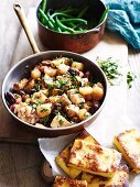 Chicken with olives and Jerusalem artichoke; served with slices of polenta