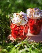 Strawberry salad with whipped cream and sugar balls