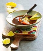 Mexican soup with avocado, tomato and courgette