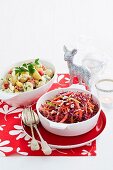 Colourful coleslaw and potato salad with tomato and egg