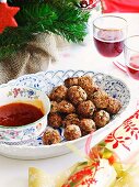 Meatballs with sesame seeds and sweet and sour sauce