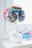 Vase of flowers made from paper cake cases