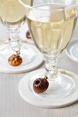 Wine glasses decorated with dolls house cake moulds