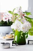 Bouquet of lilies, freesias & viburnum decorated with pastry cutters