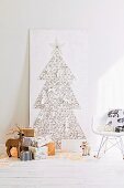 Hand-crafted Christmas tree made from nails & thread on wooden panel