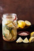 Preserved Lemons with Rosemary and Chili Peppers in a Jar