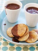 Cinnamon Tortilla Crisps Dipped in Chocolate; Cups of Melted Chocolate
