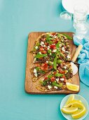 Pizza topped with lamb mince, feta, tomatoes and mint (Greece)