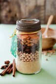 Couscous, chickpeas, raisins, almonds and dried apricots layered in a screw-top jar