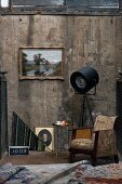 Retro armchair and old pictures against vintage wall combined with professional photographers' lamp