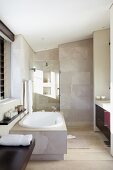 Modern bathroom with bathtub and shower area