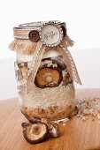 Ingredients for mushroom risotto in a screw-top jar as a gift