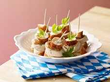 A Bavarian snack: pretzel and white sausage skewers