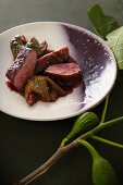 Duck breast with poached figs in red wine sauce
