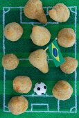 Salgadinhos (filled pastries, Brazil) with football-themed decoration