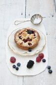 Individual berry tart with buttery crumble