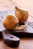 Onions on a wooden board
